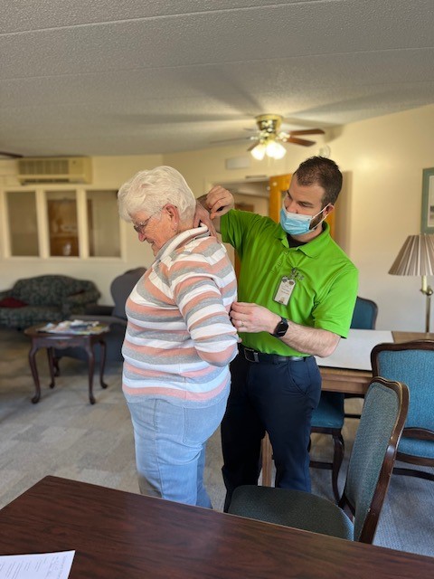 Donna Allen measuring Donnas reach behind her back