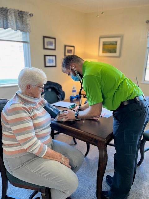 Donna Allen taking blood pressure and vitals