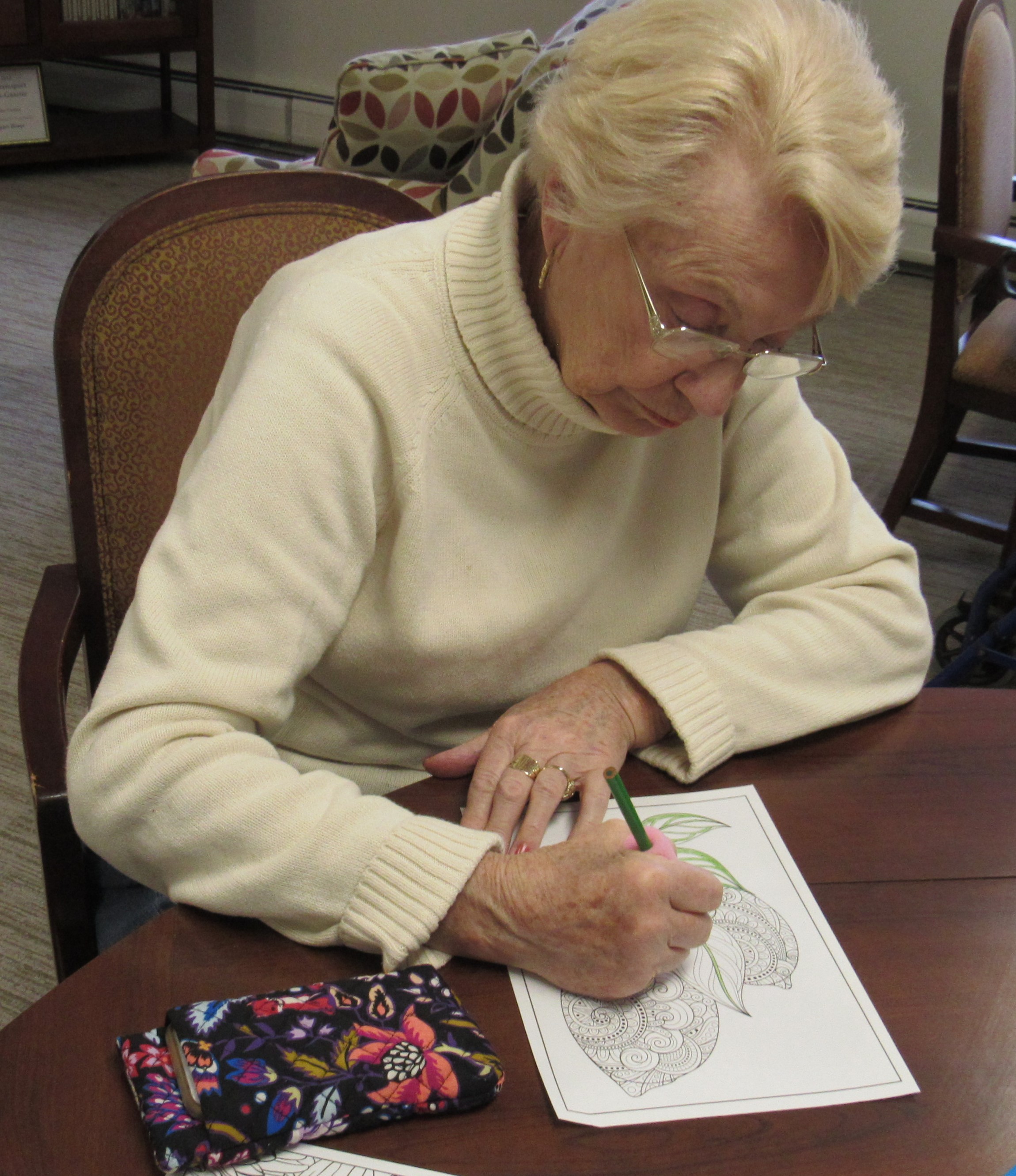 Joyce Wise doing adult coloring with Leslie from James V Brown Library
